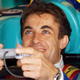 Jean Alesi unwinds between practice sessions at the 1998 Spanish Grand Prix with a PlayStation game.
